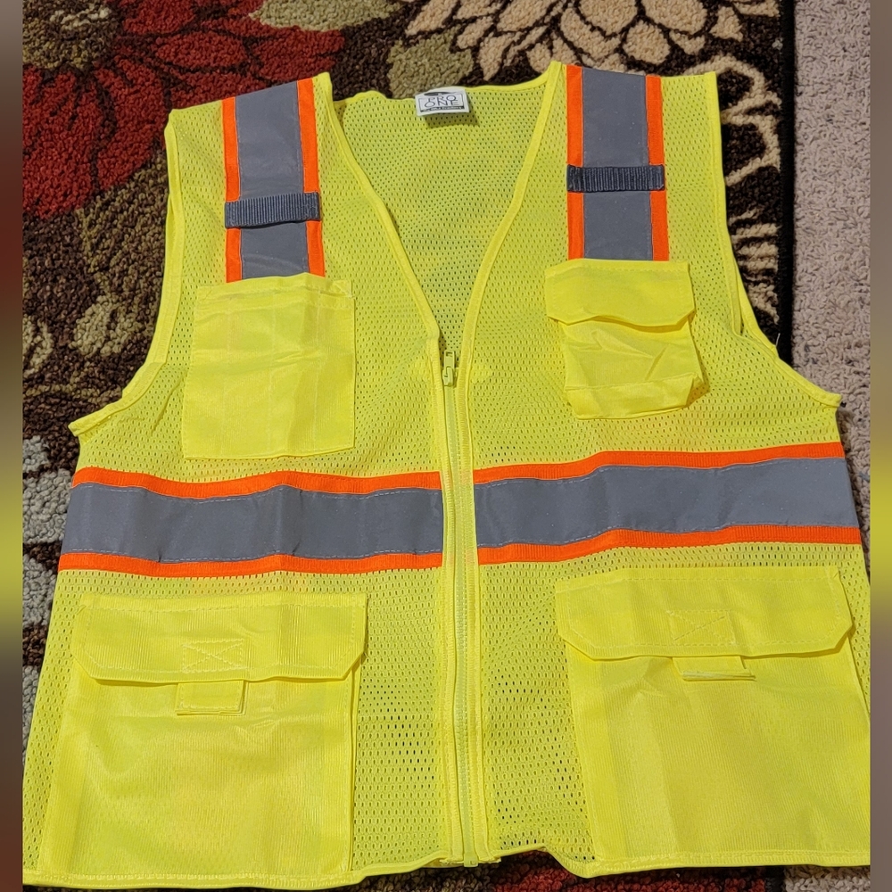 New in package yellow reflection zipper vest sign S or Med each sold separately